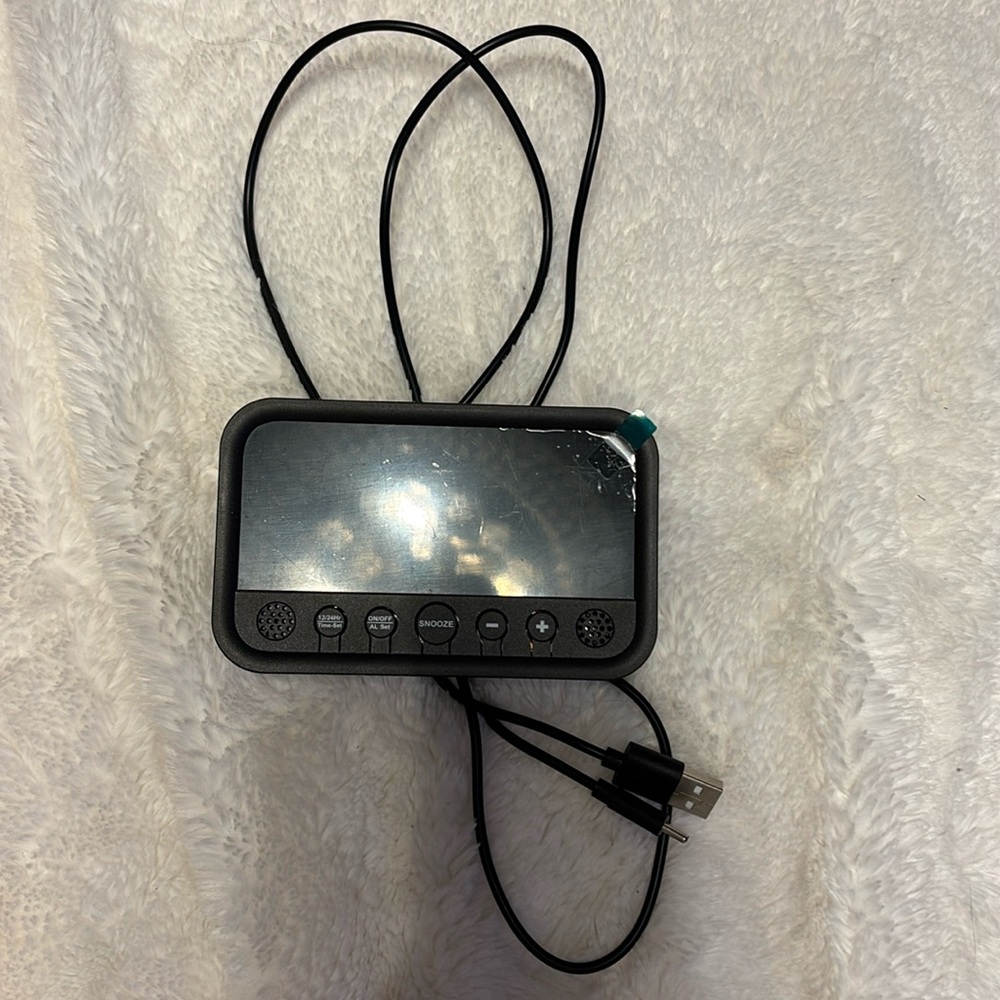 Digital alarm clock with charger cord. New.